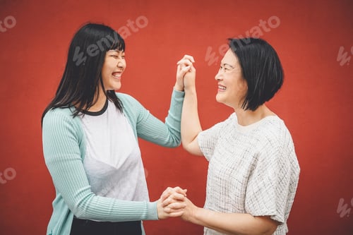 Preview: Asian mother and daughter having fun outdoor