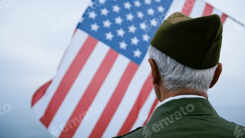 Preview: Old Veteran Soldier Looking Up At The USA Flag