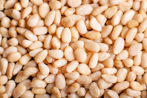 Preview: Background of Organic Pine nuts close up top view flat lay