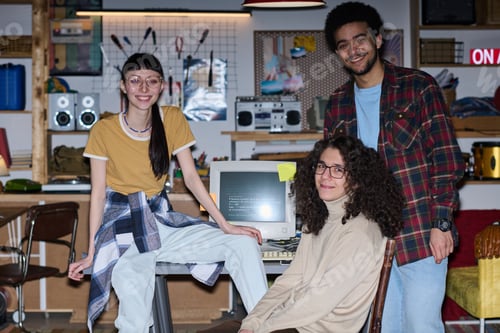 Preview: Young people working in team in garage