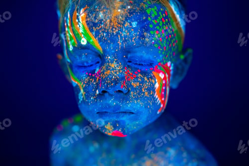 Preview: Portrait of a neon child boy posing in UV