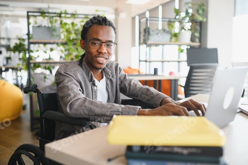 Preview: African american student typing on laptop in wheelchair