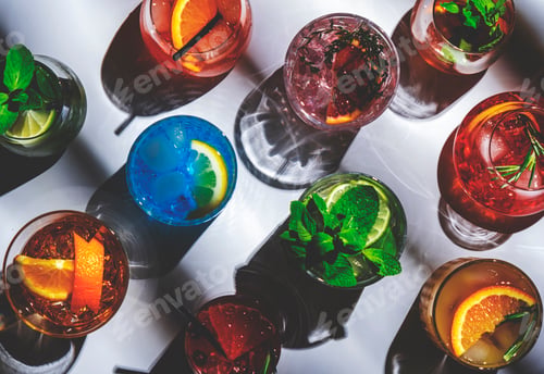 Preview: Summer alcoholic cocktails. Assortment of colorful strong and low beverages. White background