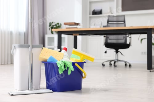 Preview: Cleaning service. Mop and bucket with supplies in office, space for text