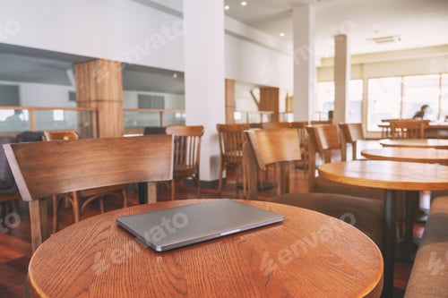 Preview: A single laptop computer on wooden table