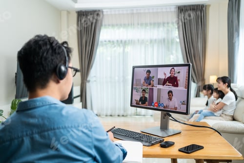 Preview: Asian Working business man father talk to colleagues team on virtual video call conference online.