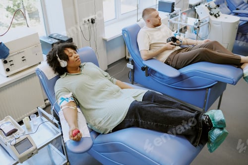 Preview: Donating Blood in Medical Facility with Modern Equipment