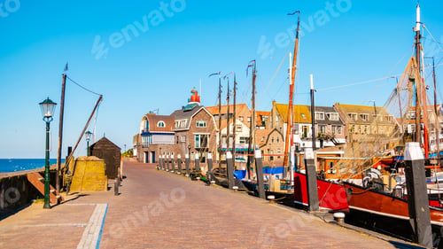 Preview: Urk Flevoland Netherlands sunset at the lighthouse and harbor of Urk Holland