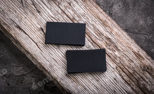 Preview: Stacks of black blank business cards on wooden background