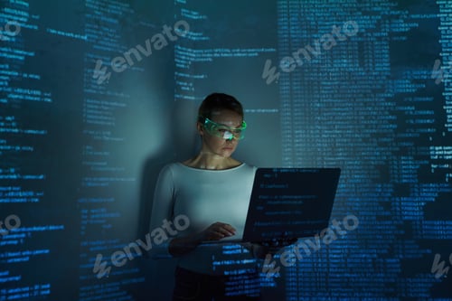 Preview: Confident woman in futuristic glasses using computer against dark background