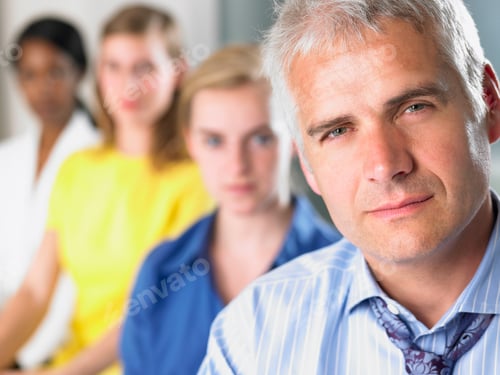Preview: Business team looking at camera