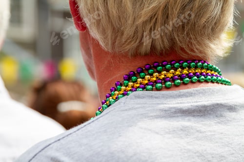 Preview: A festival goer wearing vivid necklaces