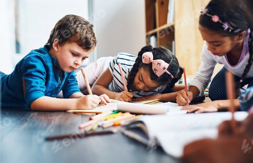 Preview: Keeping their creative minds busy. Cropped shot of kids coloring in while lying on the floor.