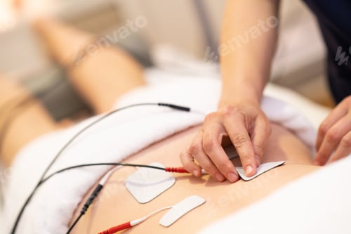 Preview: Electro stimulation in physical therapy to a young woman