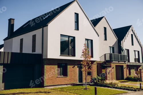 Preview: Modern townhouses facade representing suburban real estate housing development
