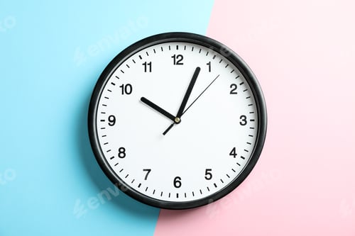Preview: Big beautiful office clock on two tone solid color pink and light blue background