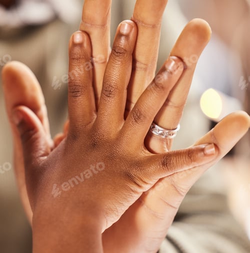 Preview: Shot of an unrecognizable parent and child giving each other a high five at home