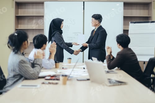 Preview: Manager awarding workers during meeting