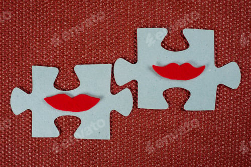 Preview: Close-up of two parts of a puzzle. Symbolic women with lips. The concept of psychological