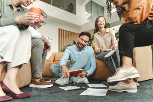 Preview: Group of smiling business people, colleagues talking, planning startup working in modern office