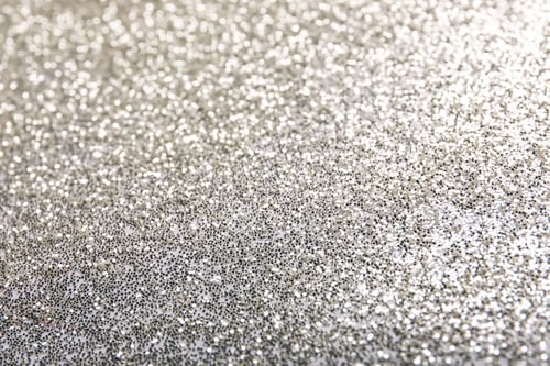 Preview: Closeup view of sparkling silver glitter background