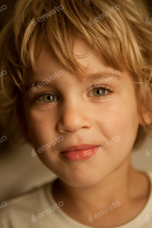 Preview: Closeup portrait of a young child with a gentle smile.