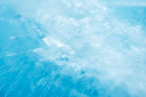 Preview: Macro ice texture with selective focus. Frosted water on blue background