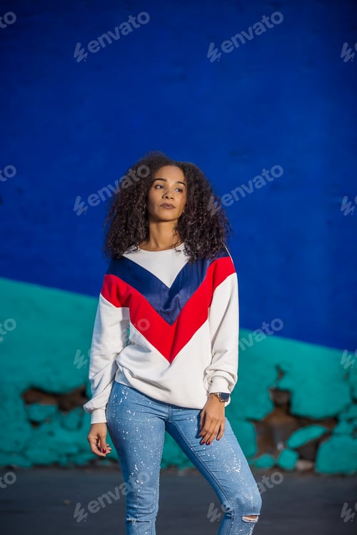 Preview: Stylish ethnic model standing confidently