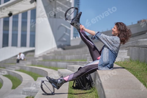 Preview: Fit legs in kangoo jumping shoes. womanpreparing for Kangoo Jumping training