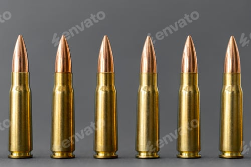 Preview: Bullets on gray background. Cartridges 7.62 caliber for Kalashnikov assault rifle
