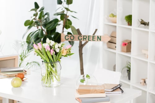 Preview: selective focus of wooden sign with go green lettering near workspace in office, environmental