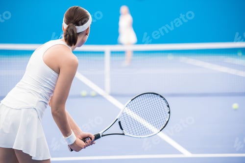 Preview: Motivated Woman Playing Tennis