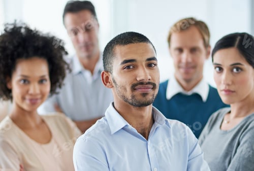 Preview: Working together towards success. Portrait of a group of diverse colleagues standing in an office.