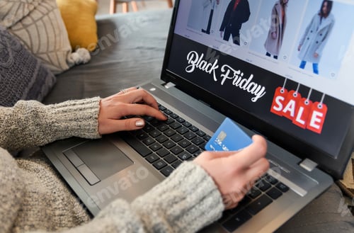 Preview: Closeup of a caucasian woman shopping online during Black Friday with her laptop indoors