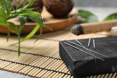 Preview: Board with needles for acupuncture on bamboo mat