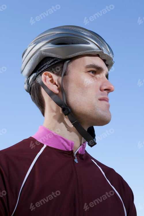 Preview: Cyclist in helmet looking forward with determination