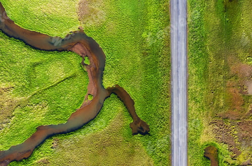 Preview: Aerial view on road in Iceland. Aerial landscape above highway in the geysers valley.