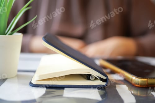 Preview: notepad, pen and smart phone on table