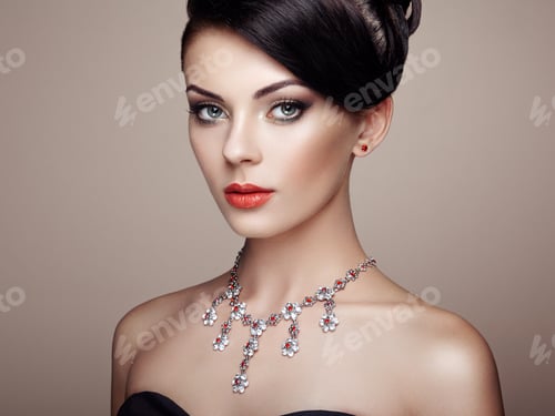 Elegant Woman with Red Jewelry and Dark Hair