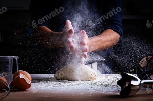Preview: Male hands making dough for pizza, dumplings or bread. Baking concept.
