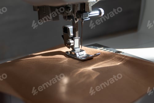 Preview: sewing machine close up view with natural sunlight, slow fashion and home sewing concept