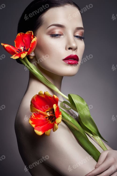 Preview: Nude Naked girl with tulips flowers in hand and perfect skin, sexy naked brunette woman to gray