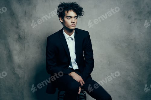 Preview: business man in a suit sitting on a chair fashion modern style Professional