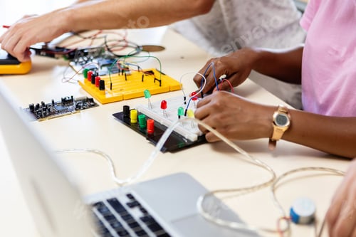 Preview: Close-up view of young students learning electronic circuit system at school