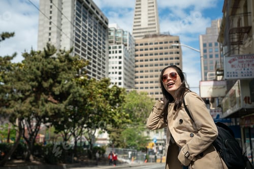 Preview: female looking at nice city landscape in SF.