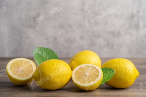 Preview: Lemon ripe fresh fruit with leaf on wooden background with copy space
