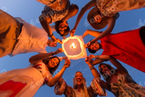Preview: Group of friends lighting lanterns