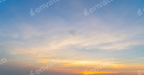 Preview: Sunset sky. Abstract nature background. Dramatic blue and orange, colorful clouds at twilight time.