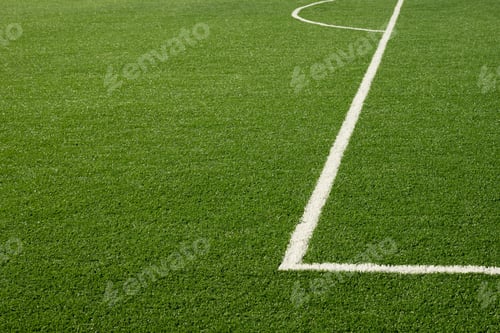 Preview: Artificial green grass with white stripe of soccer field.