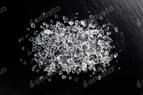 Preview: Crushed ice on black stone background, top view
